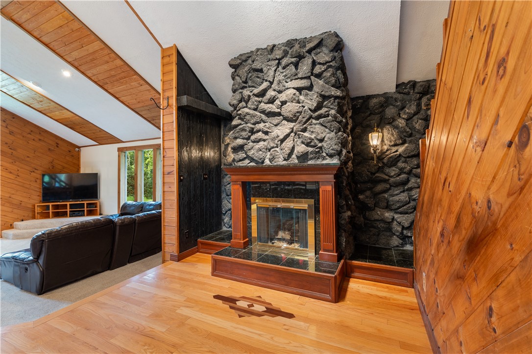 301 Spring Street Avon, NY 14414 - Photo 21 of 50 Gas fireplace off of the kitchen with space to entertain
