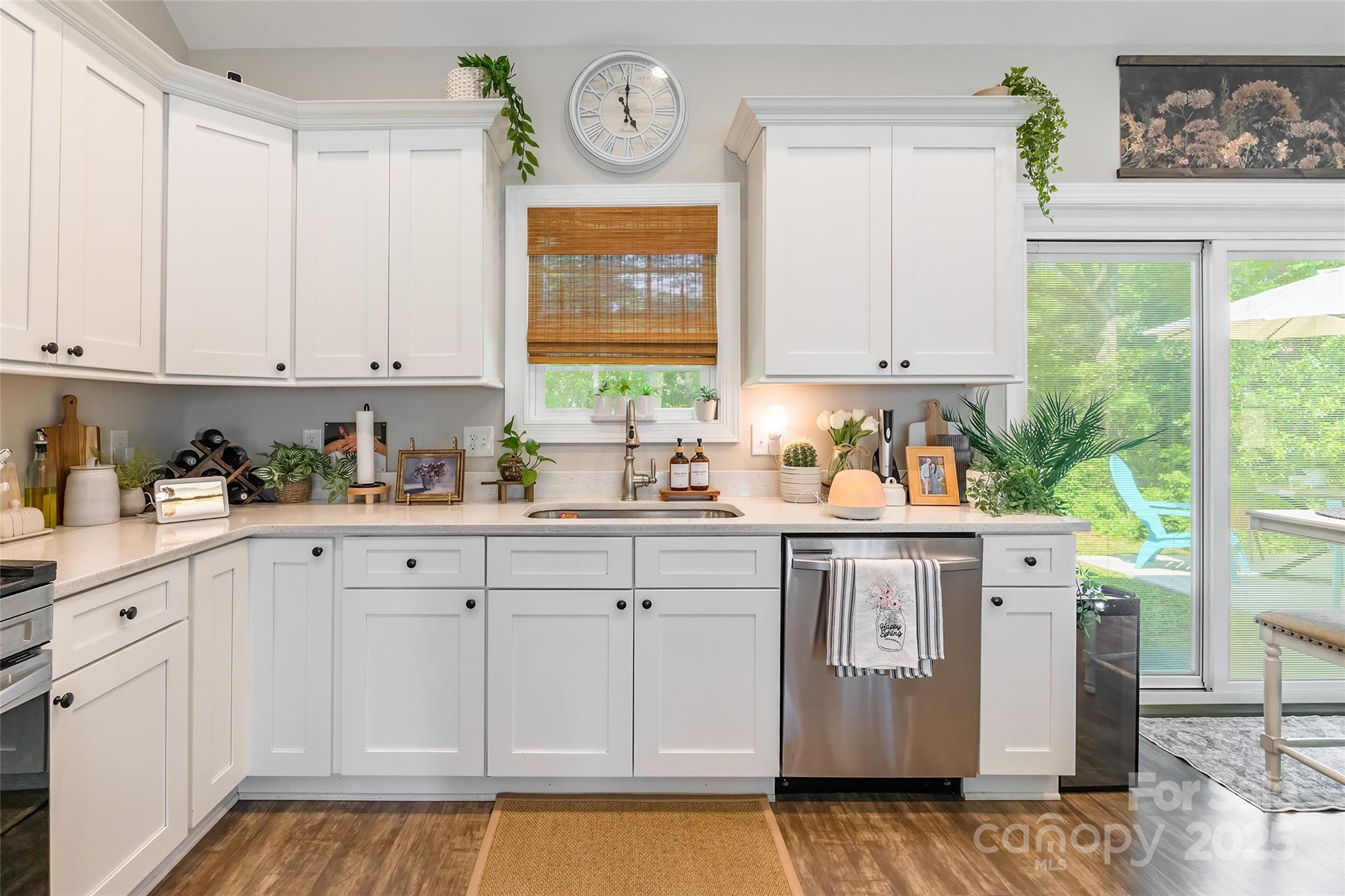 137 Ole Eastpointe Drive York, SC 29745 - Photo 11 of 28 a kitchen with stainless steel appliances granite countertop white cabinets a sink and a window