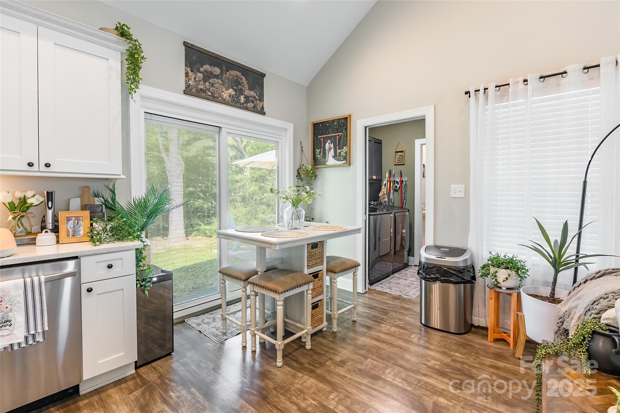 137 Ole Eastpointe Drive York, SC 29745 - Photo 13 of 28 a dining room with furniture potted plants and wooden floor