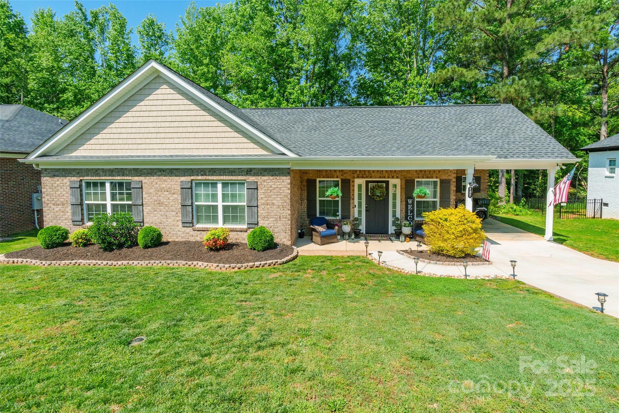 137 Ole Eastpointe Drive York, SC 29745 - Photo 3 of 28 a view of a house with backyard sitting area and garden