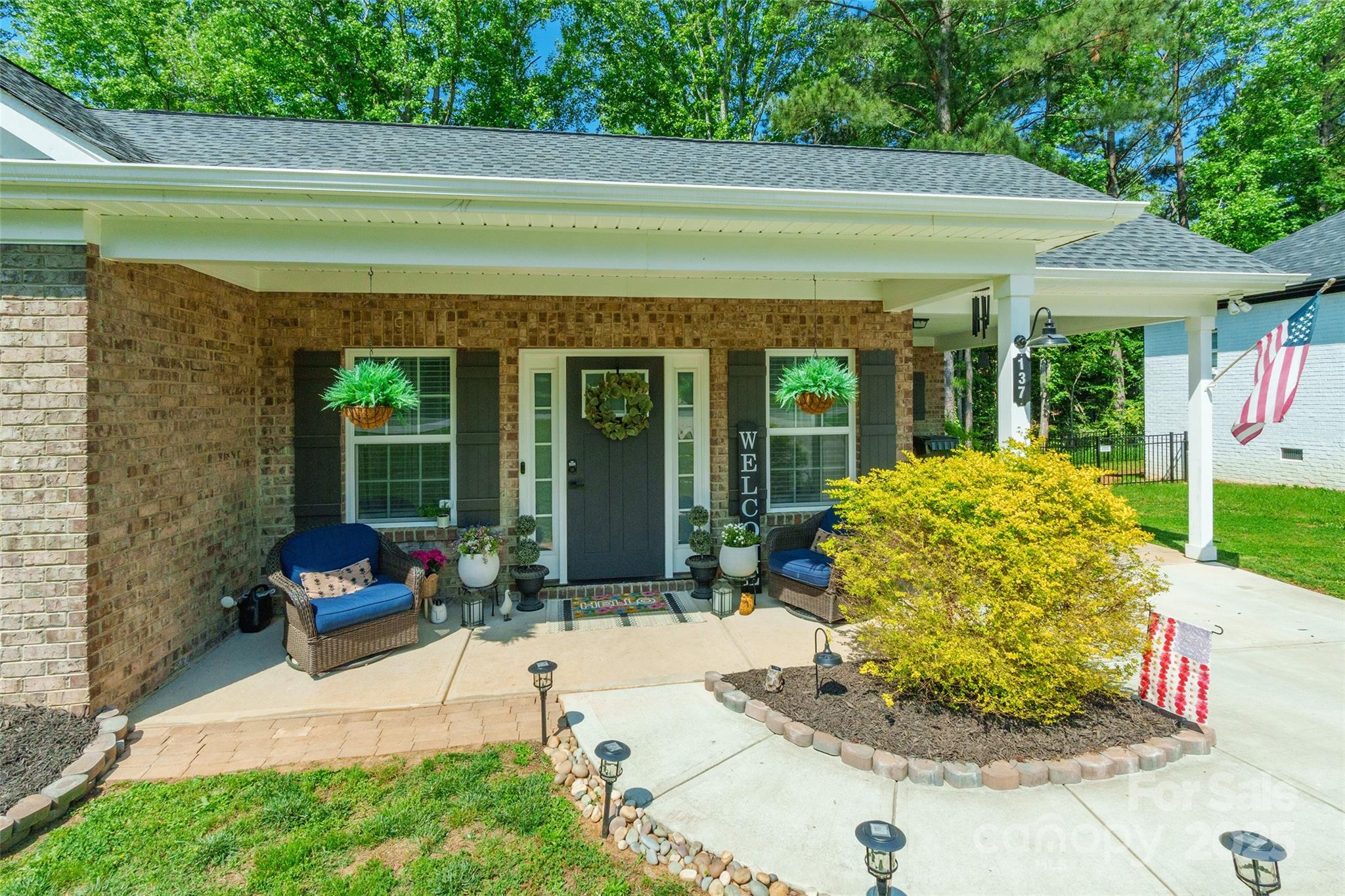 137 Ole Eastpointe Drive York, SC 29745 - Photo 4 of 28 a view of a patio with chair and tables back yard of the house