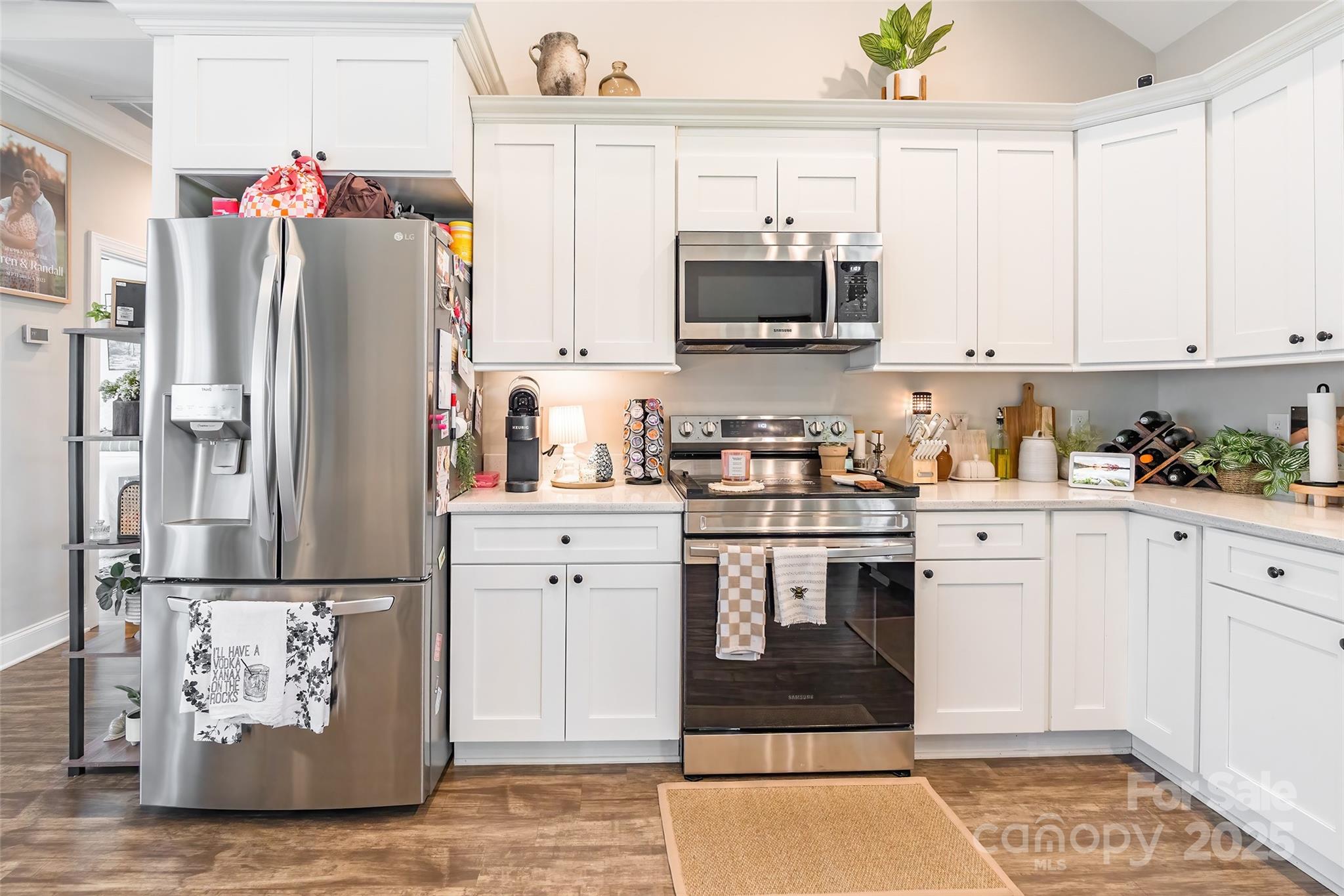 137 Ole Eastpointe Drive York, SC 29745 - Photo 10 of 28 a kitchen with stainless steel appliances granite countertop a refrigerator sink and white cabinets