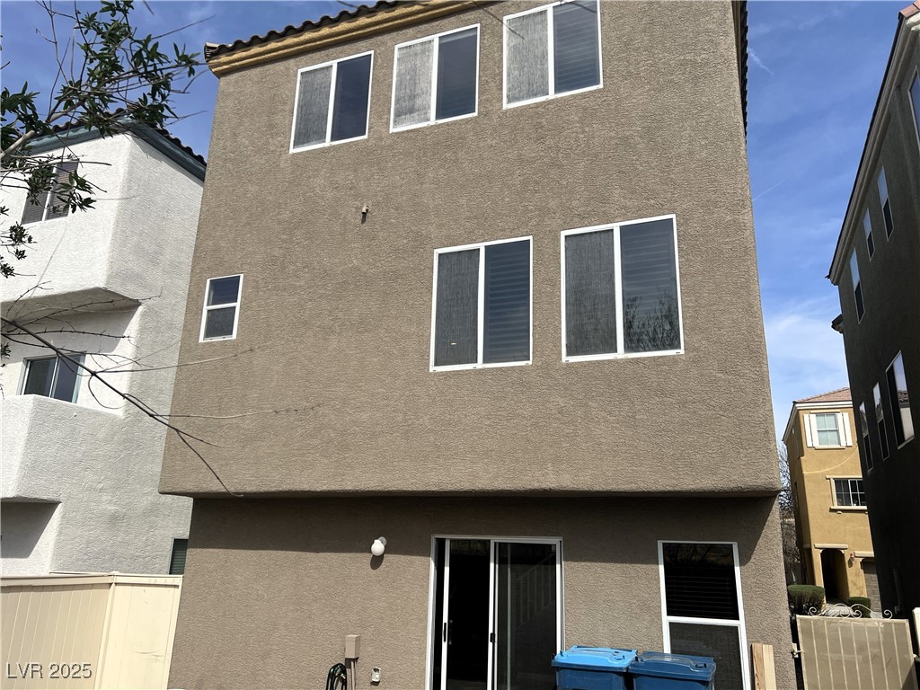 9535 Leaping Lizard Street Las Vegas, NV 89178 - Photo 24 of 37 Back of property featuring stucco siding and fence