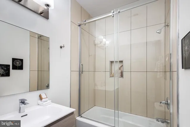 a bathroom with a sink and a shower