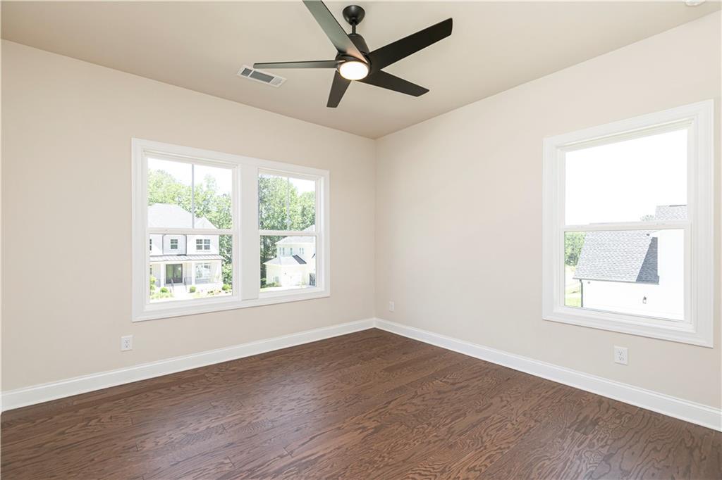 2475 Stewart Road Cumming, GA 30041 - Photo 26 of 30 an empty room with a window and a ceiling fan