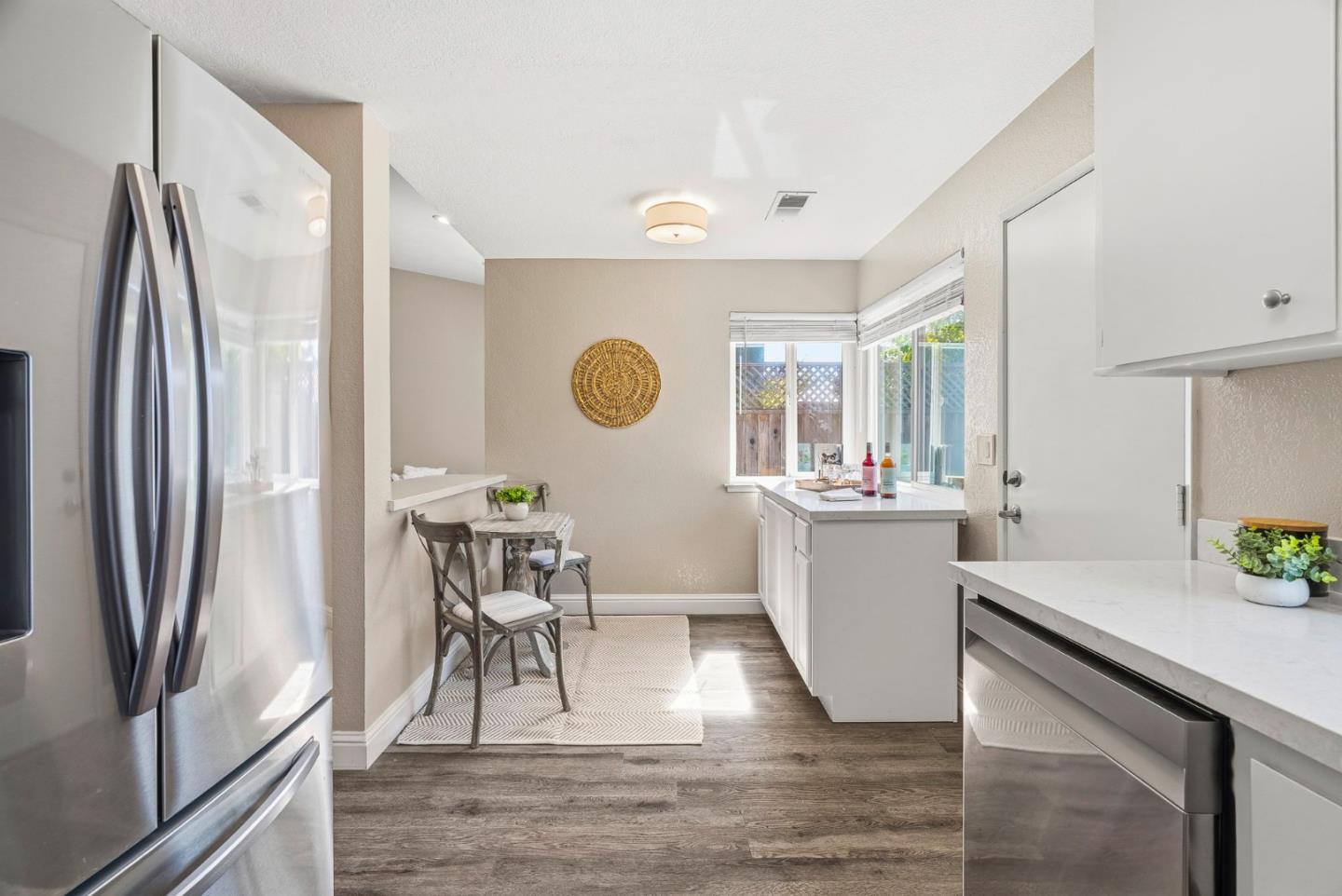 297 Perch Way Aptos, CA 95003 - Photo 13 of 42 a kitchen with a refrigerator and a sink