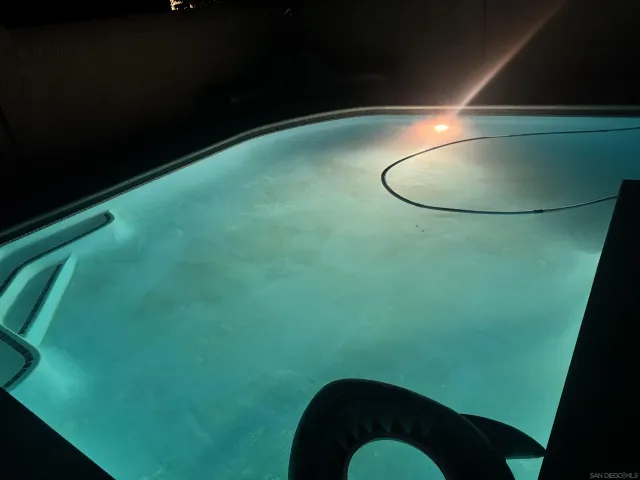a kitchen with a sink stove top oven and refrigerator