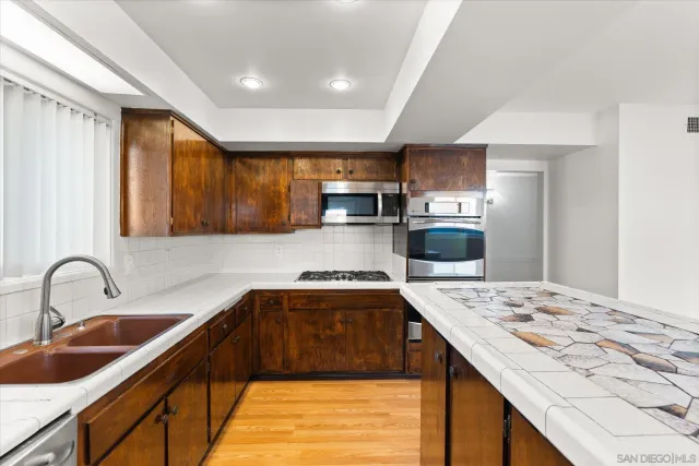 a building outdoor space with patio furniture and potted plants