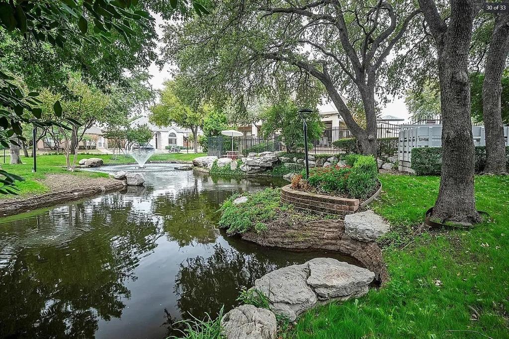4242 North Capistrano Drive, Unit 118 Dallas, TX 75287 - Photo 20 of 25 a view of a lake with large trees