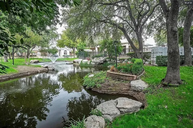 a view of a lake with a yard