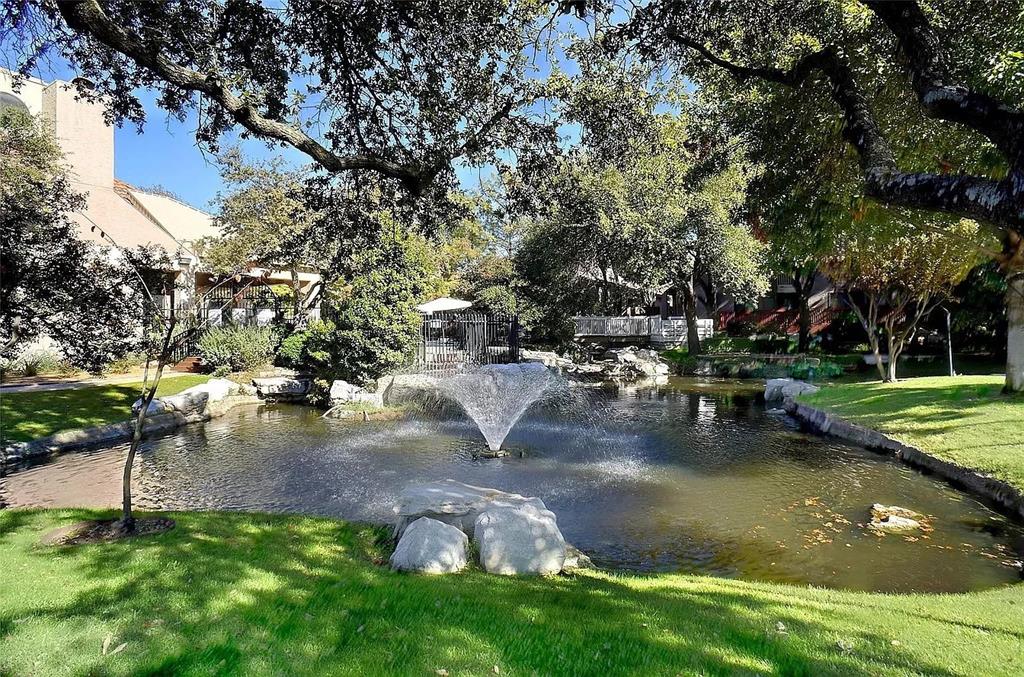 4242 North Capistrano Drive, Unit 118 Dallas, TX 75287 - Photo 21 of 25 a view of a lake with a yard