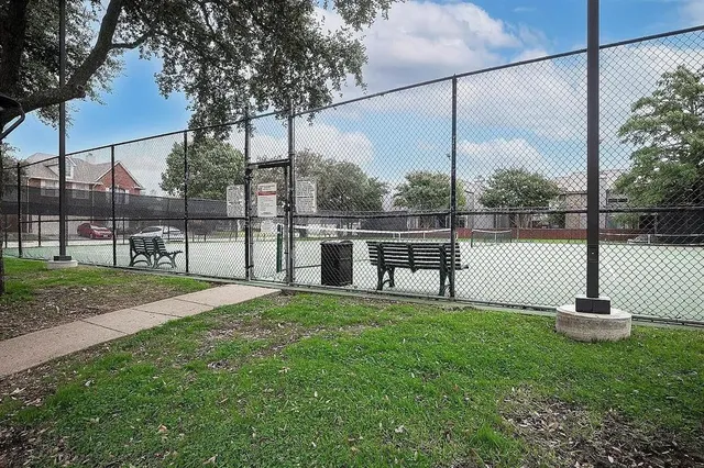 a view of a chair and table in the yard