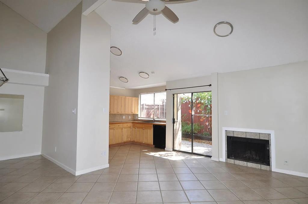 4242 North Capistrano Drive, Unit 118 Dallas, TX 75287 - Photo 4 of 25 a view of a kitchen with a dishwasher and a fireplace