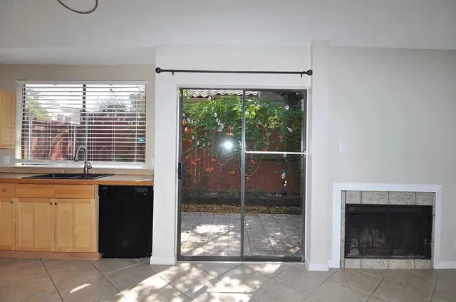 a view of an empty room with a fireplace
