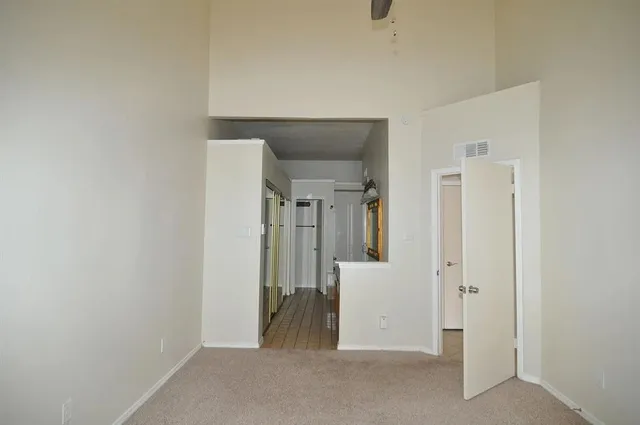 a view of a room with a hallway