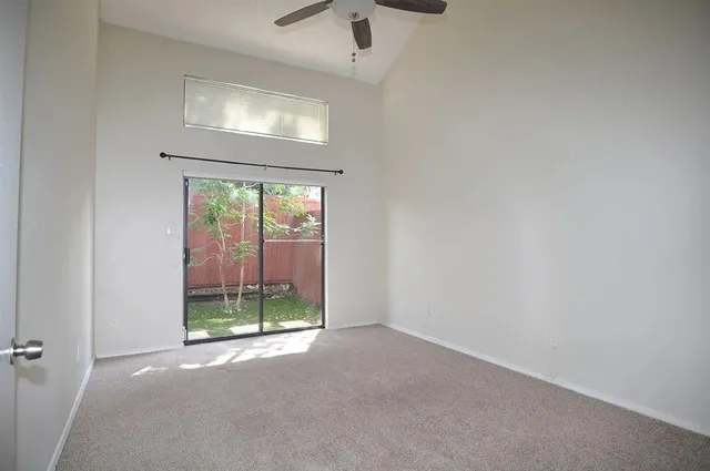 a view of a room with a hallway