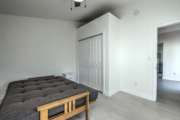 a bedroom with a bed and a dresser