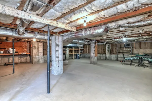 a view of empty room with wooden ceiling