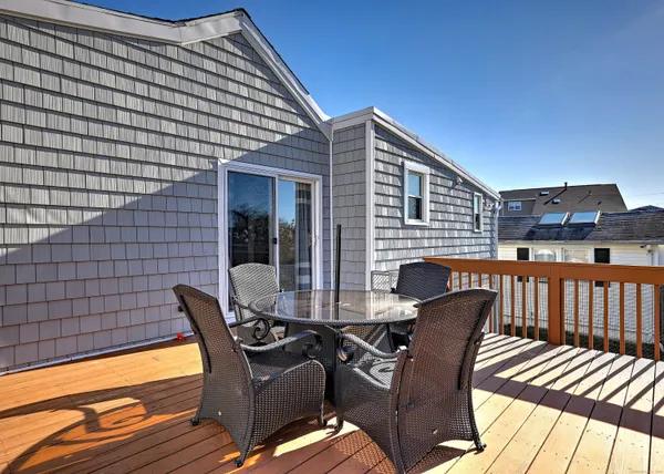 a view of a patio with a table and chairs