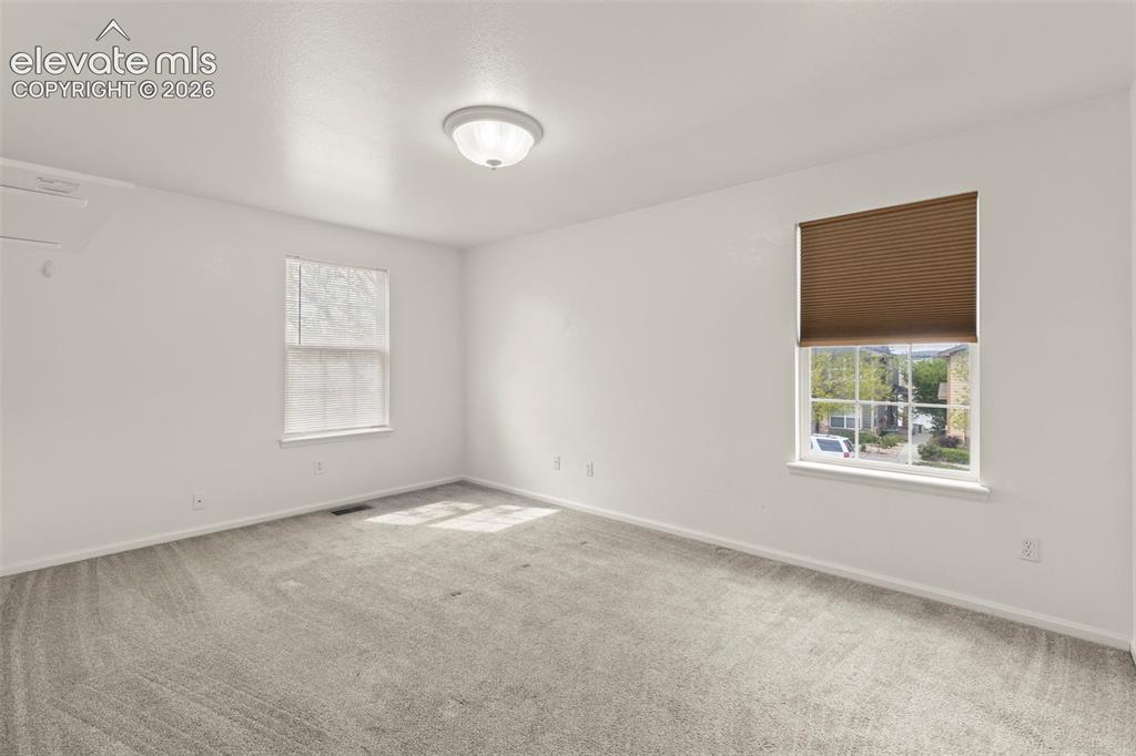 1563 Monterey Road, Unit D Colorado Springs, CO 80910 - Photo 8 of 22 an empty room with windows