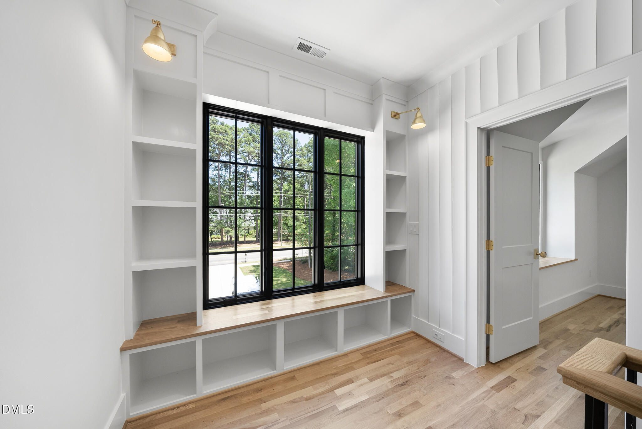 1609 Ridge Road Raleigh, NC 27607 - Photo 34 of 62 a view of an empty room with wooden floor and a window