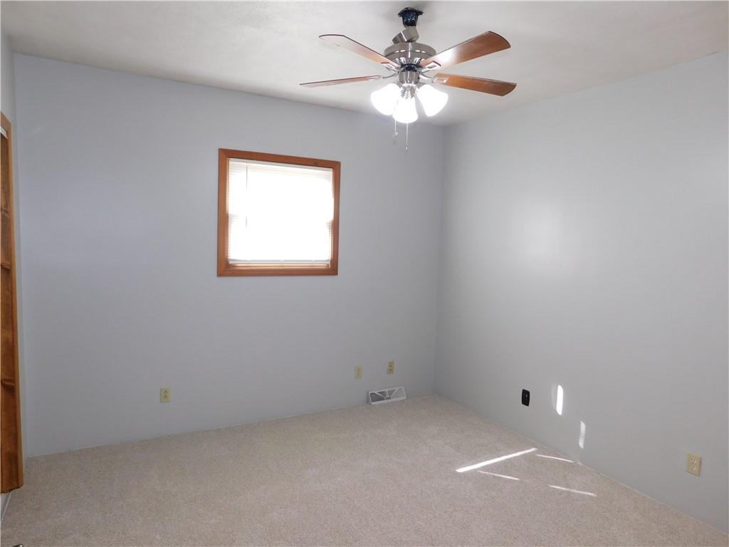 425 Vaneal Road Washington, PA 15301 - Photo 15 of 24 an empty room with a window and a fan