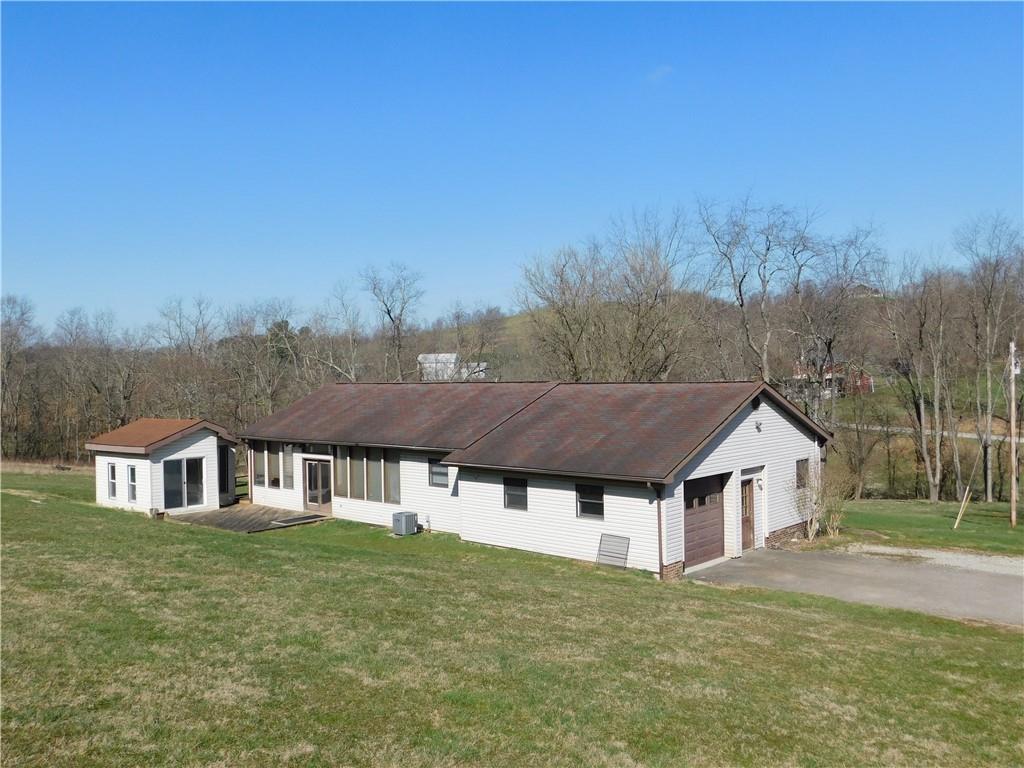 425 Vaneal Road Washington, PA 15301 - Photo 3 of 24 a aerial view of residential houses with yard and trees in the background