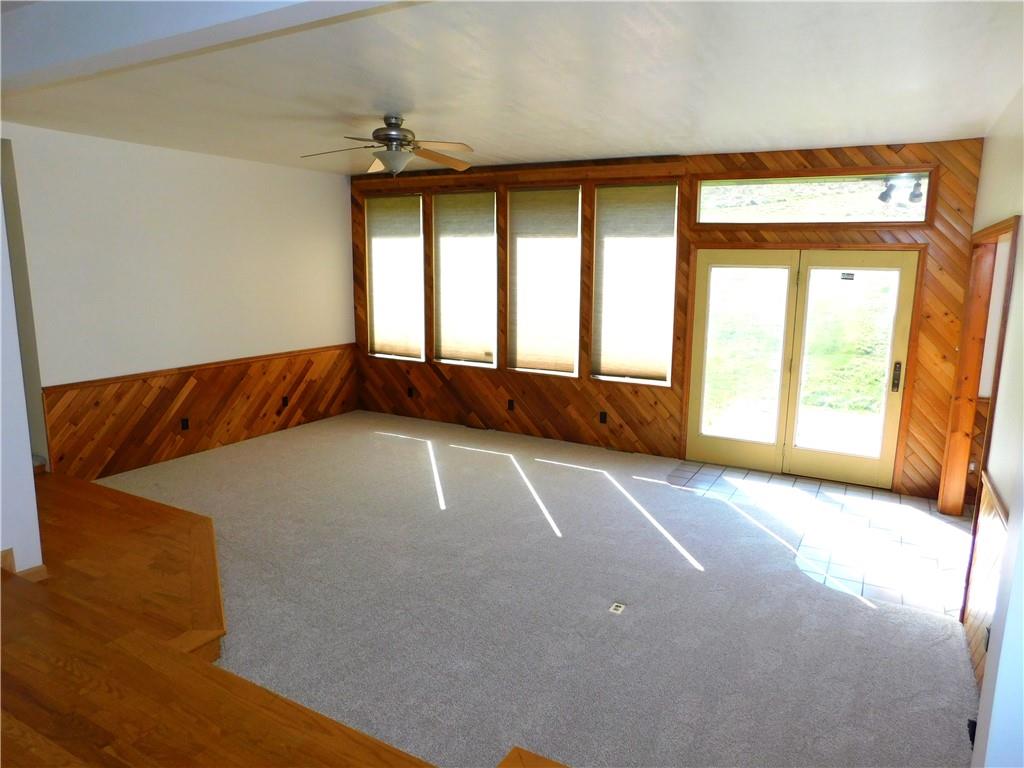 425 Vaneal Road Washington, PA 15301 - Photo 10 of 24 a view of an empty room with a fireplace and a window
