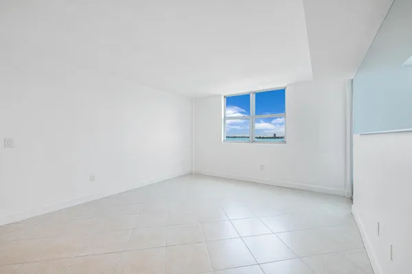 a view of an empty room and window