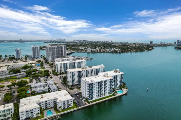 an aerial view of a house with lake view