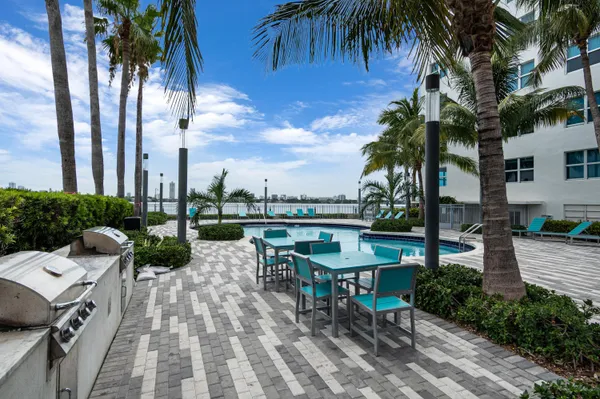 a view of a swimming pool with a patio