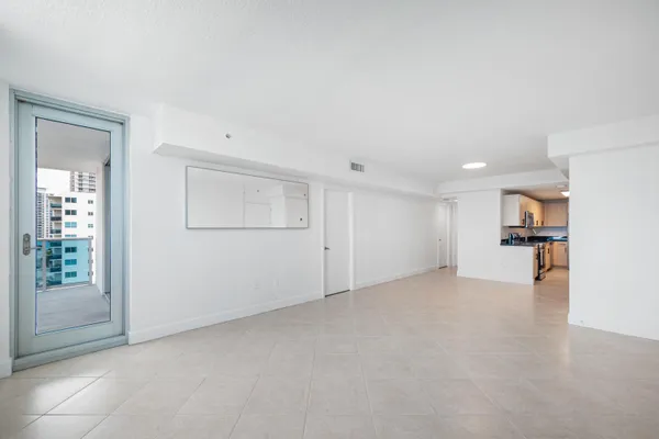 a view of an empty room with a cabinet