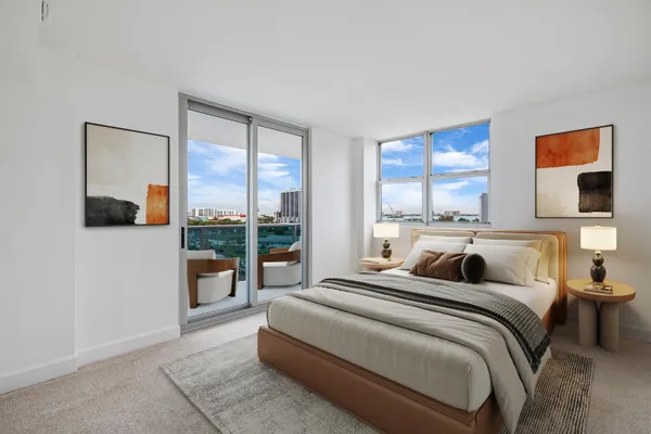 a bed room with a bed and a large window