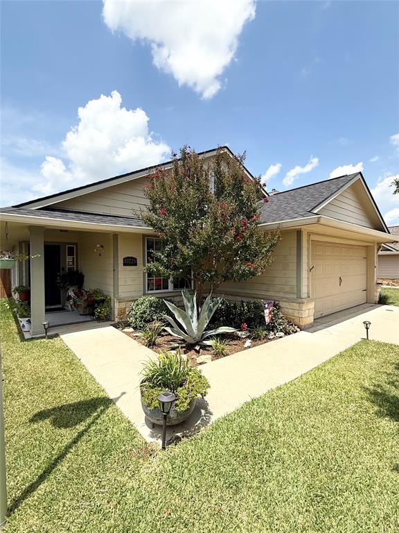 a view of a house with snow on the side of the road