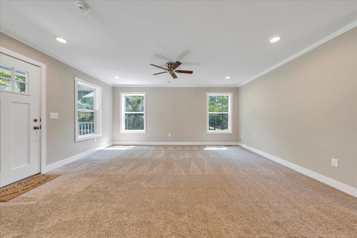 165 Spence Road Union Hall, VA 24176 - Photo 11 of 58 an empty room with windows and ceiling fan