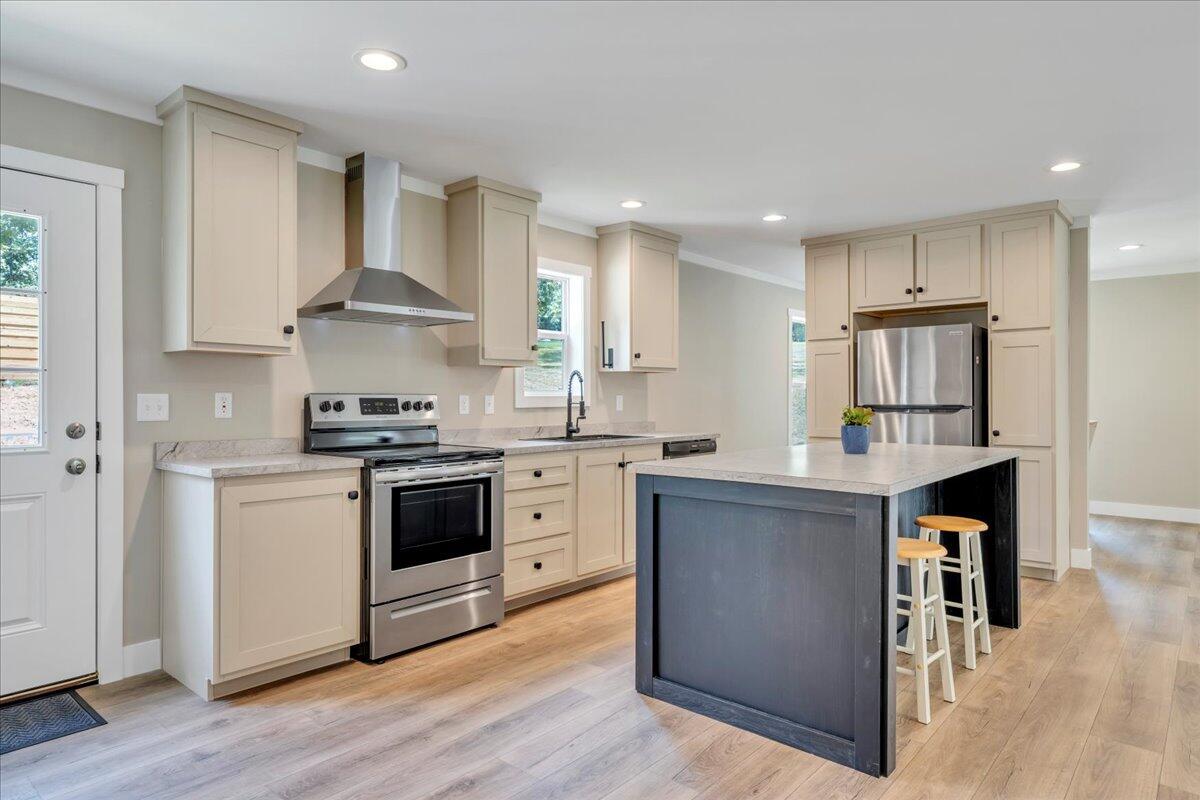 165 Spence Road Union Hall, VA 24176 - Photo 19 of 58 a kitchen with stainless steel appliances granite countertop a stove and a refrigerator