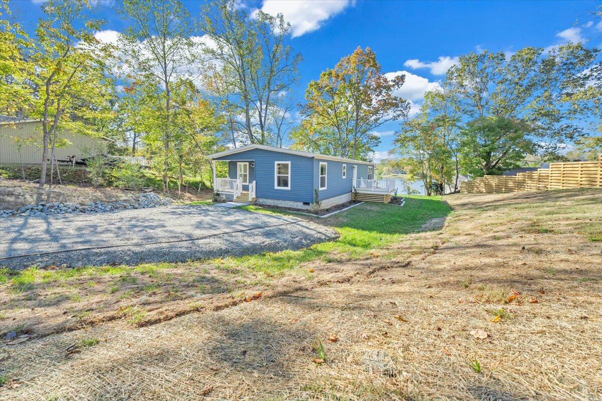 165 Spence Road Union Hall, VA 24176 - Photo 49 of 58 a front view of a house with a yard and garage