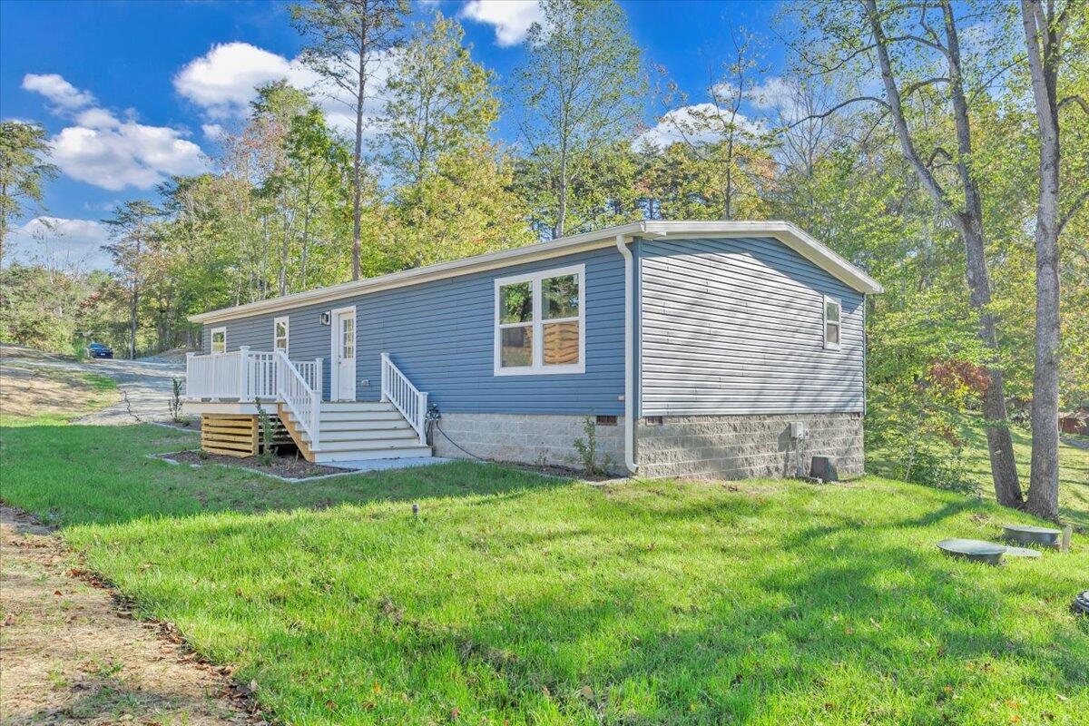 165 Spence Road Union Hall, VA 24176 - Photo 54 of 58 a view of a house with a yard and sitting area