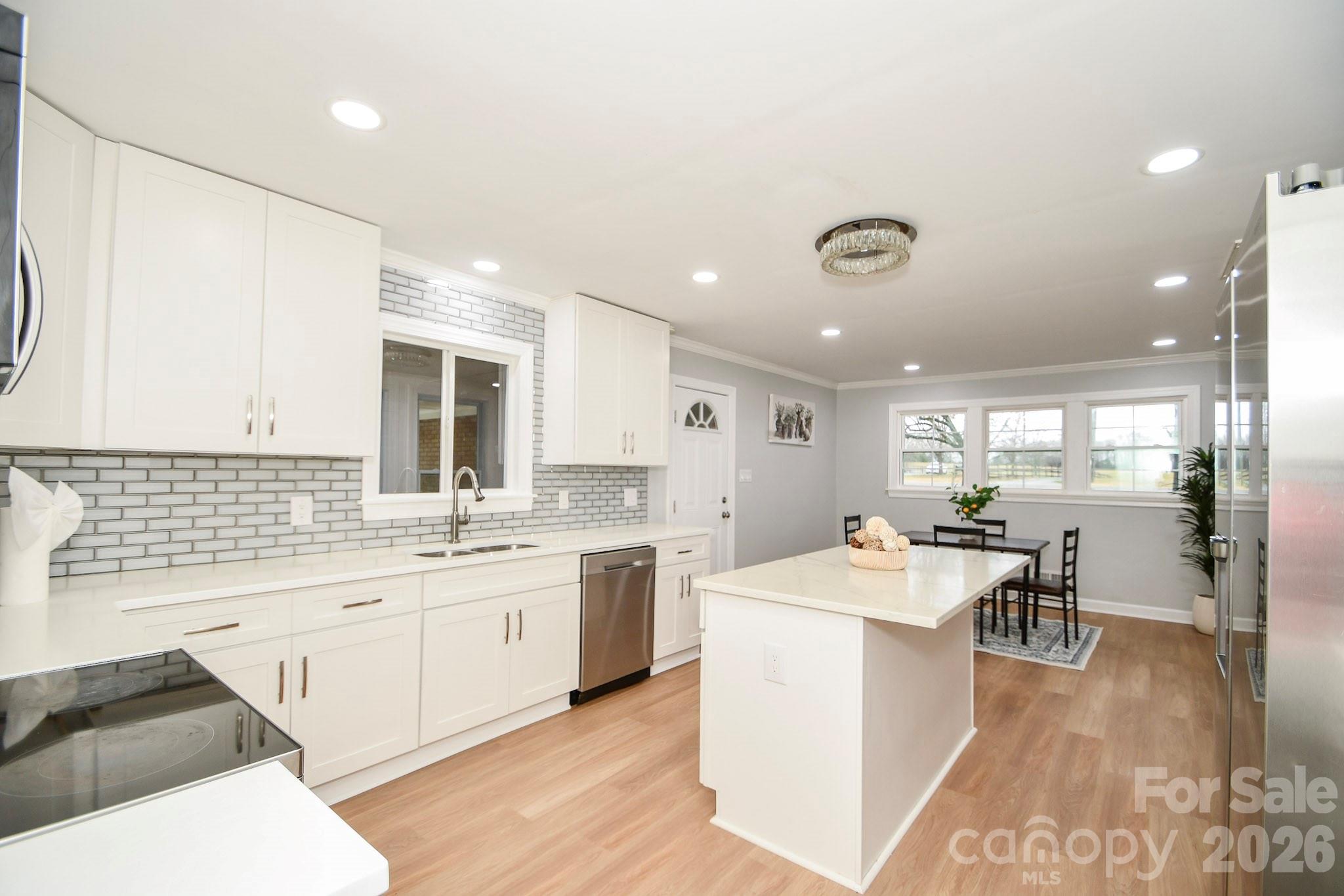 4517 Plyler Mill Road Monroe, NC 28112 - Photo 11 of 37 a large white kitchen with a large window