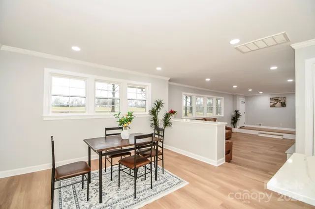 a kitchen with a table and chairs in it