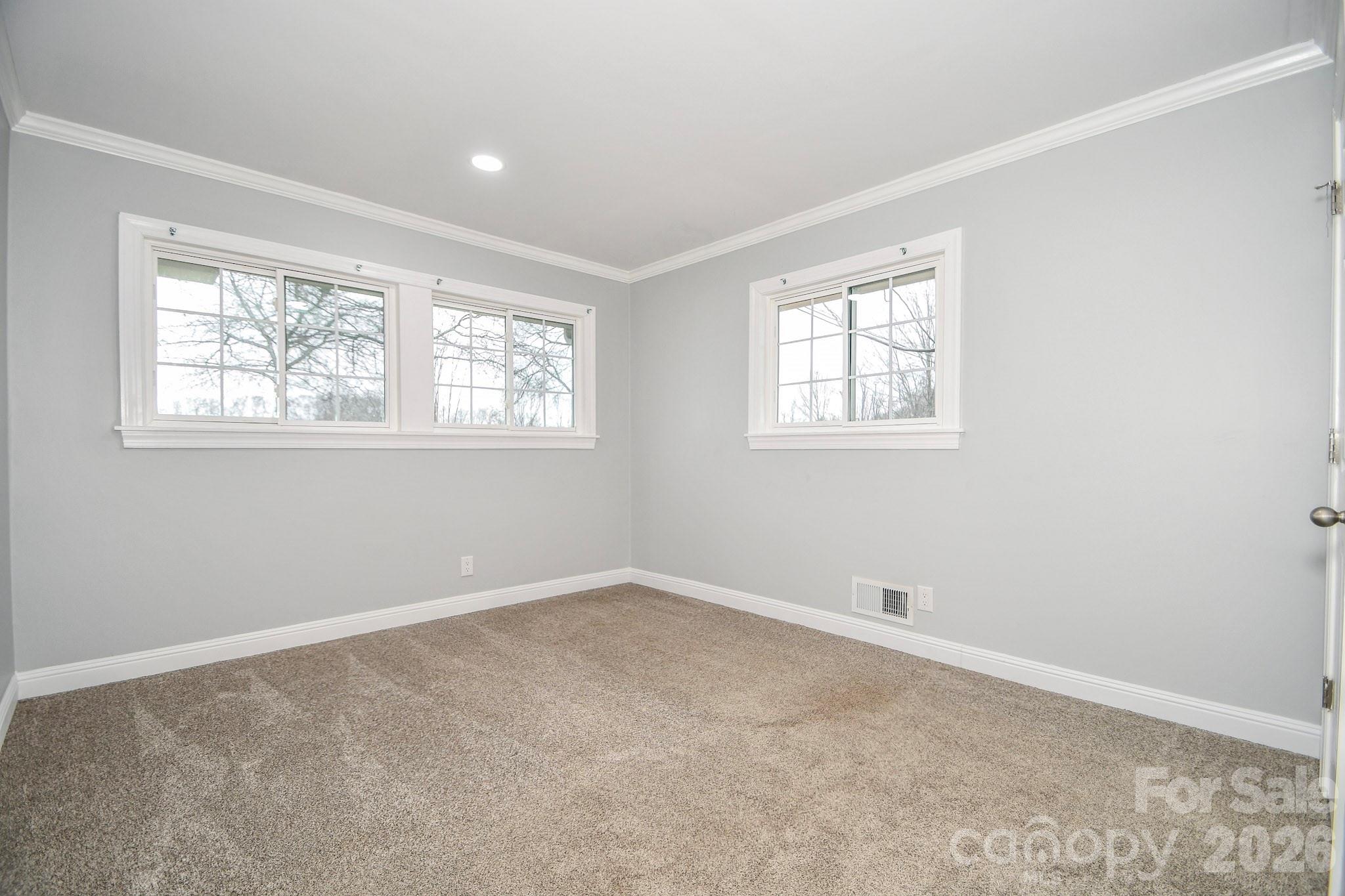 4517 Plyler Mill Road Monroe, NC 28112 - Photo 20 of 37 an empty room with windows