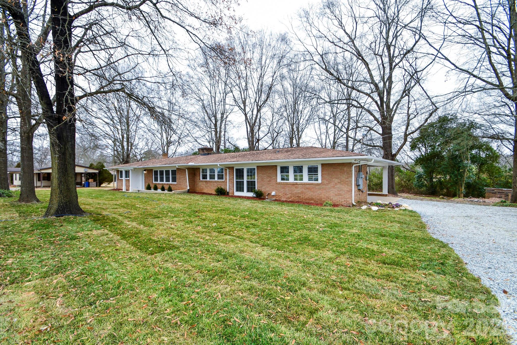 4517 Plyler Mill Road Monroe, NC 28112 - Photo 2 of 37 a view of a house with a yard