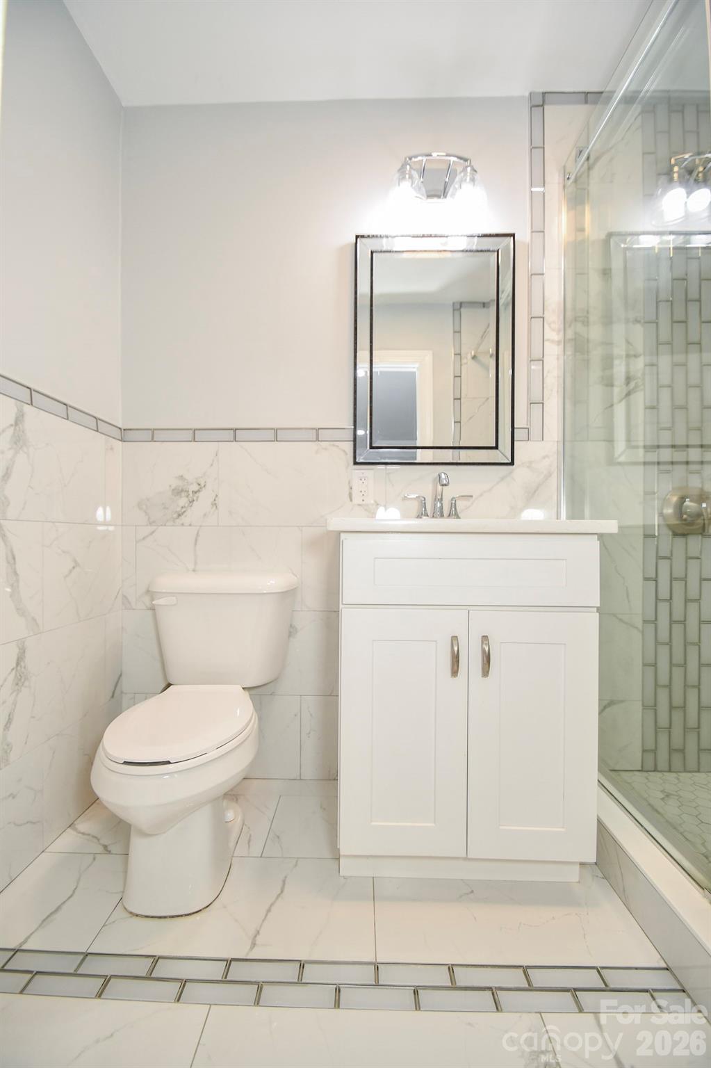 4517 Plyler Mill Road Monroe, NC 28112 - Photo 26 of 37 a bathroom with a sink toilet and mirror