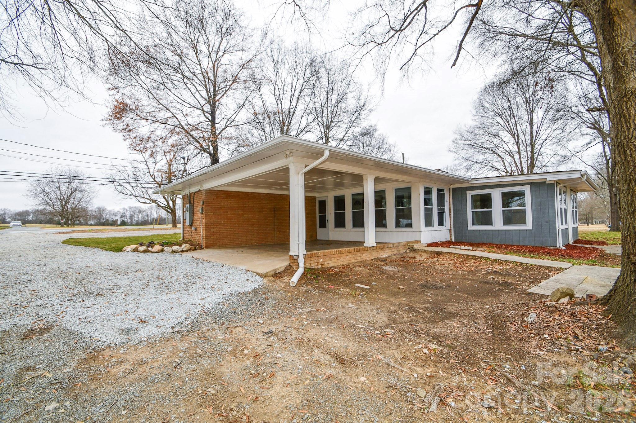 4517 Plyler Mill Road Monroe, NC 28112 - Photo 36 of 37 a view of a house with a yard and sitting area