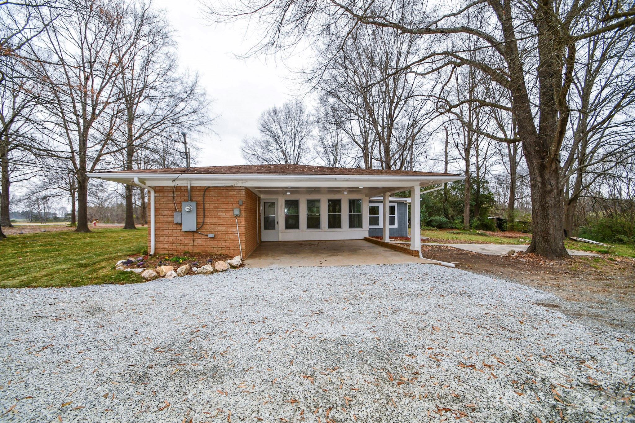 4517 Plyler Mill Road Monroe, NC 28112 - Photo 6 of 37 front view of a house with a yard