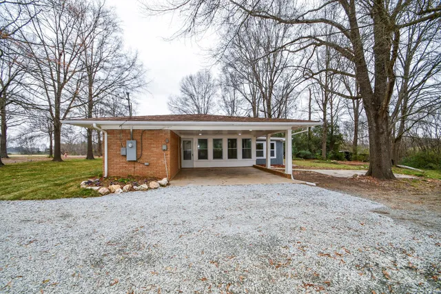 front view of a house with a yard