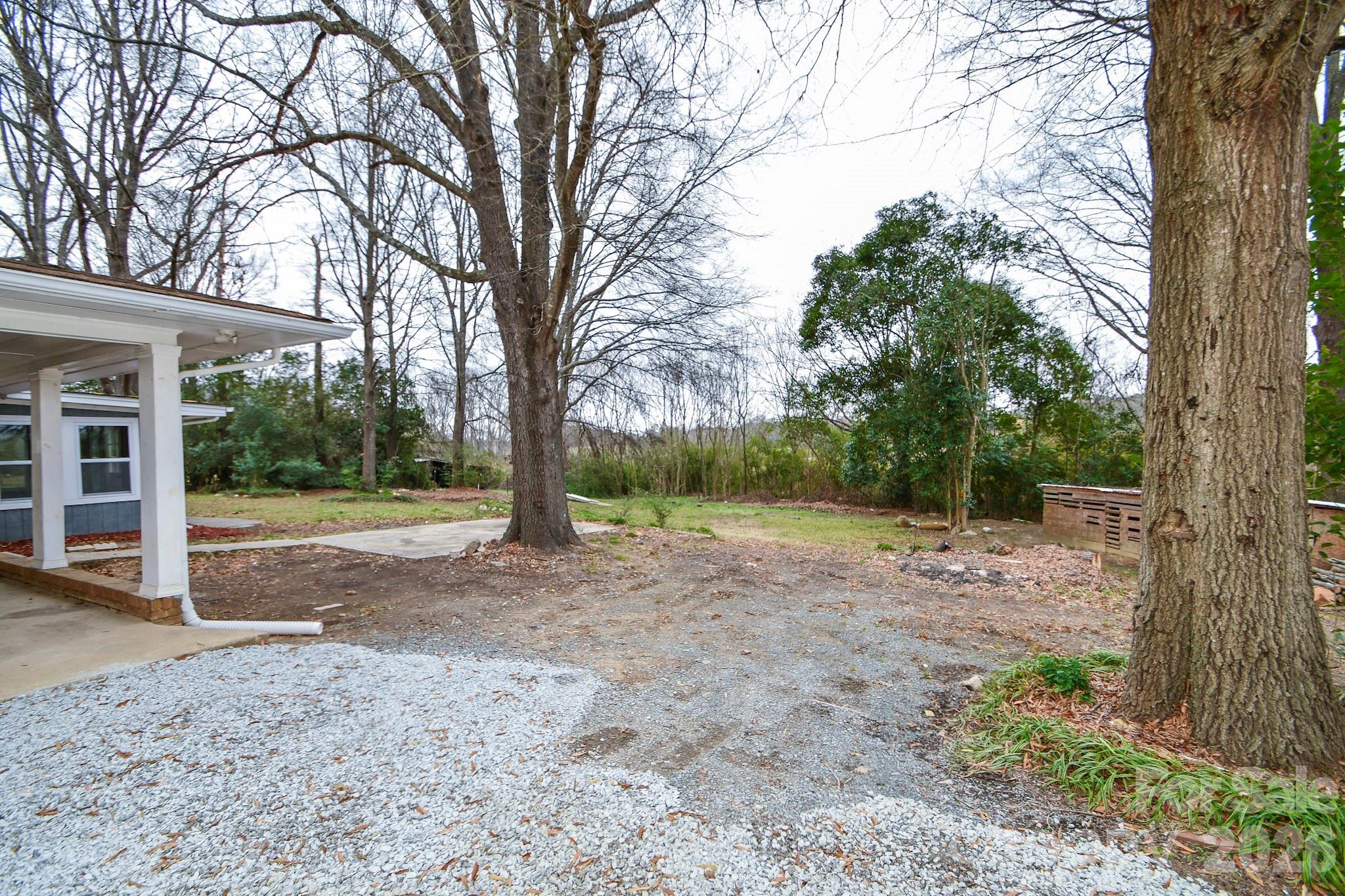 4517 Plyler Mill Road Monroe, NC 28112 - Photo 7 of 37 a view of a yard with large tree
