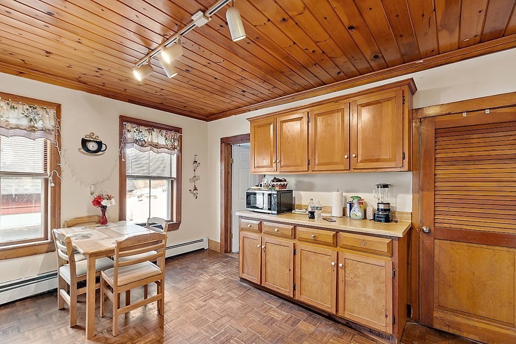 a kitchen with sink cabinets and wooden floor