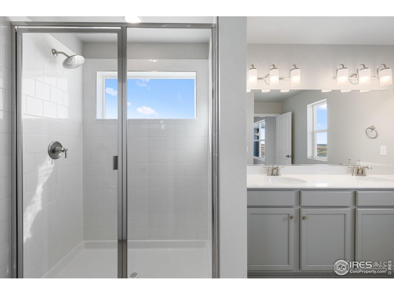 6765 Utica Court Firestone, CO 80504 - Photo 15 of 23 a bathroom with a sink and a mirror