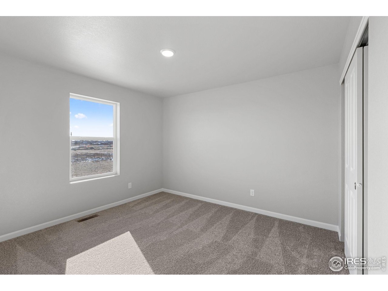 6765 Utica Court Firestone, CO 80504 - Photo 17 of 23 a view of an empty room with a window